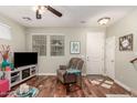 Living room with hardwood floors, brown recliner, and a view of the front door at 26015 N 53Rd Dr, Phoenix, AZ 85083