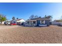 Cute gray house with a gravel yard and white fence at 2605 W Montebello Ave, Phoenix, AZ 85017