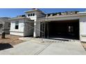 New construction home featuring modern architecture, a spacious garage, and a sturdy roof at 27256 N 74Th Ln, Peoria, AZ 85383