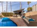 Inviting pool area with a covered patio and seating at 2824 S Bala Dr, Tempe, AZ 85282