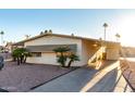 Side view of a single-story manufactured home with a covered carport at 401 N 68Th Ave # 247, Phoenix, AZ 85043