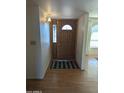 Inviting entryway with wood flooring and a charming stained glass door at 5110 E Edgewood Ave, Mesa, AZ 85206