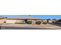 Front view of a single-story brick home with a garage and mature shrubs at 5110 E Edgewood Ave, Mesa, AZ 85206