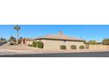 Side view of a light brown brick ranch style home with desert landscaping at 5110 E Edgewood Ave, Mesa, AZ 85206