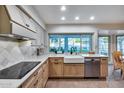 A well lit and bright kitchen featuring stainless steel appliances and plenty of countertop space at 6320 E Kings Ave, Scottsdale, AZ 85254