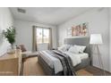 Well-lit bedroom featuring a comfortable bed and tasteful decor at 7030 W Cypress St, Phoenix, AZ 85035