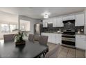 Modern kitchen with white cabinets and dark countertops at 7030 W Cypress St, Phoenix, AZ 85035