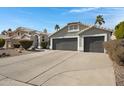 Two-story house with gray exterior and a two-car garage at 810 S Lagoon Dr, Gilbert, AZ 85233