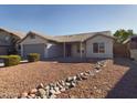 House exterior features a covered patio and landscaped yard at 8623 W Athens St, Peoria, AZ 85382