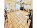 Spacious living room with tile floors and fireplace at 1006 E Pasadena Ave, Phoenix, AZ 85014