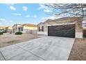 Recently built home with a two-car garage and neutral exterior at 11225 E Marigold Ln, Florence, AZ 85132