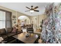 Open living room with a view into the dining area and kitchen at 1161 S Storment Ln, Gilbert, AZ 85296