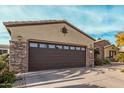 Single-story home with desert landscaping and a two-car garage at 15452 W Skyview Way, Surprise, AZ 85374