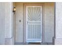 Front entrance with security door and welcoming mat at 15665 W Azalea Ln, Surprise, AZ 85374