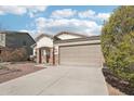 One-story home with a two-car garage and desert landscaping at 17680 W Lilac St, Goodyear, AZ 85338