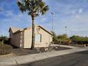 Tan house with a two-car garage and desert landscaping at 18803 N 16Th Pl, Phoenix, AZ 85024