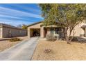 Attached garage with open door revealing storage items at 194 E Watson Pl, Casa Grande, AZ 85122