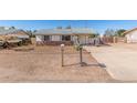 Charming single-story home featuring a rock facade and a xeriscape yard at 1940 S Coconino Dr, Apache Junction, AZ 85120