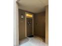 Inviting entryway with a charming wreath and modern light fixture at 20100 N 78Th Pl # 1092, Scottsdale, AZ 85255