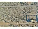 Aerial shot of vacant land with future home outlined, adjacent to a new house at 20235 W Highland Ave, Litchfield Park, AZ 85340