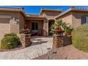 Front entry with stone pillars and walkway at 20652 N Wishing Well Ln, Maricopa, AZ 85138