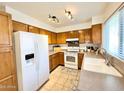 Bright kitchen with wood cabinets and modern appliances at 2615 W Hearn Rd, Phoenix, AZ 85023