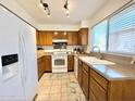 Bright kitchen with wood cabinets and modern appliances at 2615 W Hearn Rd, Phoenix, AZ 85023