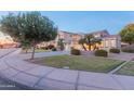 Two-story house with a landscaped yard and driveway at 306 E Dennisport Ct, Gilbert, AZ 85295