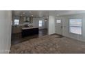 Modern kitchen with island, stainless steel appliances, and light cabinets at 318 S Ellsworth Rd, Mesa, AZ 85208