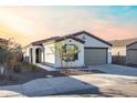 New construction home with desert landscaping and two-car garage at 3818 S 84Th Ln, Tolleson, AZ 85353