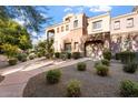 Exterior view of a two-story townhome at 3935 E Rough Rider Rd # 1270, Phoenix, AZ 85050