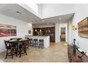 Kitchen with island, dark cabinets, and granite counters at 3935 E Rough Rider Rd # 1270, Phoenix, AZ 85050