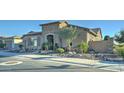 Beautiful exterior view showcasing the landscaped front yard and the inviting stone accents of the home at 4053 E Zion Way, Chandler, AZ 85249