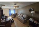 Living room with two couches and a wooden cabinet at 4411 N 56Th Dr, Phoenix, AZ 85031