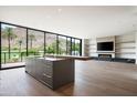 Open living space with kitchen island, fireplace, and stunning views at 4575 N Phoenician Blvd # 2, Scottsdale, AZ 85251
