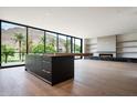 Bright open concept living space featuring floor to ceiling windows, fireplace and sleek island at 4575 N Phoenician Blvd # 4, Scottsdale, AZ 85251