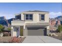 Two-story house with a gray garage door and desert landscaping at 5132 E Umber Rd, San Tan Valley, AZ 85143