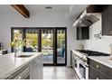 Modern kitchen with stainless steel appliances and an island at 5328 N 46Th St, Phoenix, AZ 85018