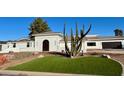 Stunning modern home with attractive landscaping and a large front yard at 6912 E Larkspur Dr, Scottsdale, AZ 85254