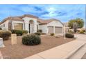 One-story home with a two-car garage and well-maintained landscaping at 747 E Nolan Pl, Chandler, AZ 85249