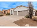 House exterior featuring a two-car garage and drought-tolerant landscaping at 747 E Nolan Pl, Chandler, AZ 85249