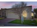 Charming single-story home with a well-maintained lawn, two-car garage and desert landscaping at 8243 E Cortez Dr, Scottsdale, AZ 85260