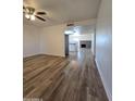 Spacious living room with wood-look floors and fireplace at 8651 W Glenrosa Ave, Phoenix, AZ 85037