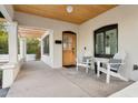 Relaxing front porch with wooden ceiling and comfortable seating at 929 E Granada Rd, Phoenix, AZ 85006