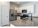 Modern kitchen with stainless steel appliances and granite countertops at 9447 W Glenrosa Ave, Phoenix, AZ 85037