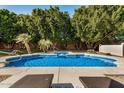 Relaxing pool area with ample space for lounging at 9524 W Running Deer Trl, Peoria, AZ 85383