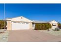 Front view of a single-story home with a two-car garage at 9526 W Briarwood N Cir, Sun City, AZ 85351