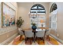 Bright dining room features a round table and modern chandelier at 9915 E Cinnabar Ave, Scottsdale, AZ 85258