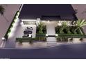 A stunning aerial view shows the home's driveway, landscaping, and modern design at 11612 N 86Th St, Scottsdale, AZ 85260