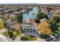 Luxury waterfront home with expansive lake views and circular driveway at 1519 E Treasure Cove Dr, Gilbert, AZ 85234